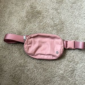 Lululemon 1L belt bag. Used, still good but I got a bigger size.